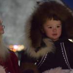 Danny Dommek takes photos with Santa at Soldotna Creek Park on Saturday, Dec. 4, 2021. (Camille Botello/Peninsula Clarion)