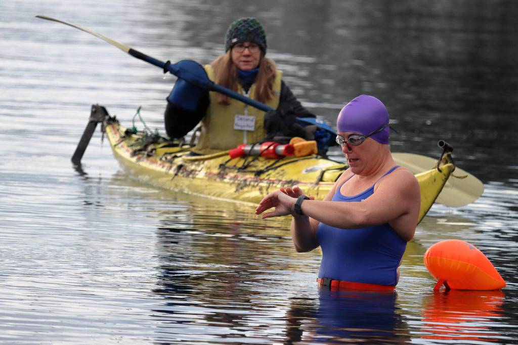 Ben Hohenstatt / Juneau Empire
Cheryl Fellman checks her watch before attempting an Ice Mile. An Ice Mile is a type of endurance swim that tasks swimmers with covering a mile in water that is 41 degrees or colder.