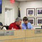 Assembly members Richard Derkevorkian (left) and Jesse Bjorkman (right) consult during a meeting of the Kenai Peninsula Borough Assembly on Tuesday, Dec. 7, 2021 in Soldotna, Alaska. (Ashlyn O'Hara)