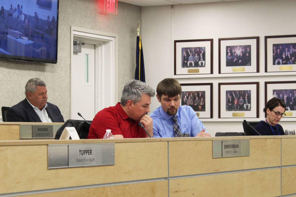 Kenai Peninsula Borough Mayor Charlie Pierce (back) and assembly members Richard Derkevorkian (left) and Jesse Bjorkman (right) particpate in a meeting of the Kenai Peninsula Borough Assembly on Tuesday in Soldotna. (Photo by Ashlyn OHara/Peninsula Clarion)