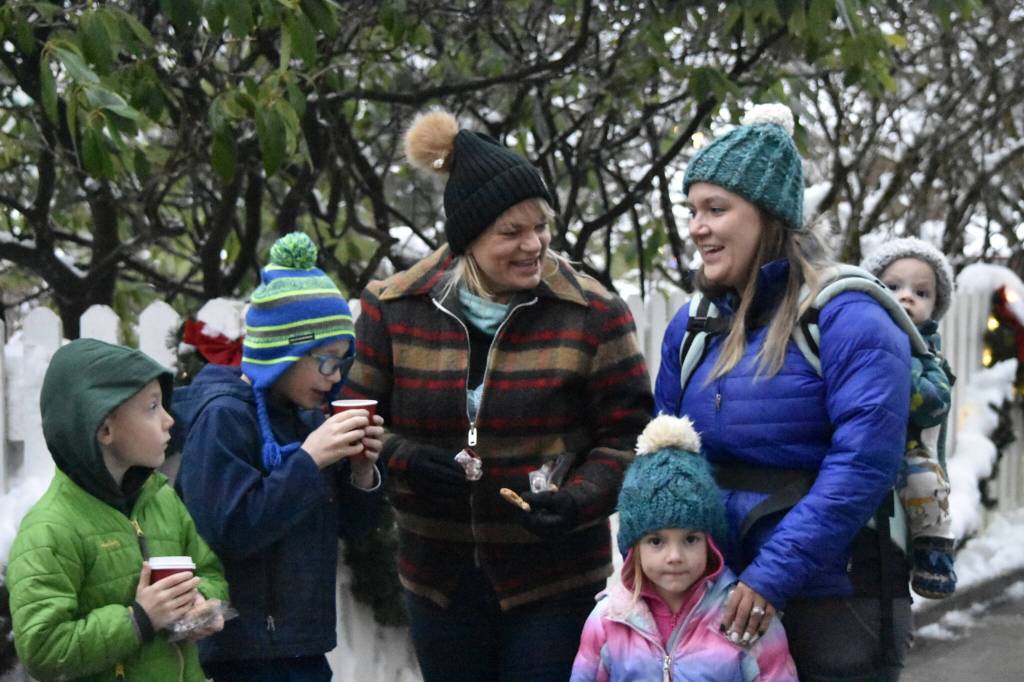 Peter Segall / Capital City Weekly
The Boehm family, from left to right, Maverick, Archer, Char, Elaina, Tina and McCoy wait outside the Alaska Governors Mansion on Tuesday for a Christmas open house event. Tina Boehm said she comes regularly with her family.
