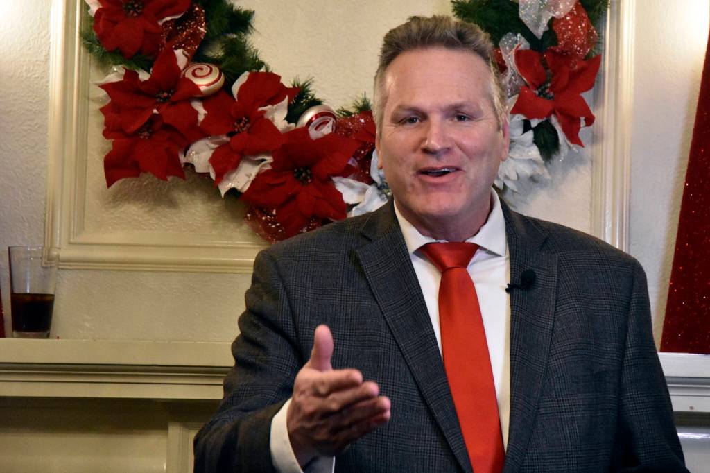 Gov. Mike Dunleavy spoke with reporters at the Alaska Governors Mansion on Tuesday, Dec. 7, 2021, before greeting guests for the traditional Christmas open house. The event was suspended last year due to COVID-19 but was back this year with limited health mitigation rules in place. (Peter Segall / Juneau Empire)