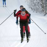 Kenai Centrals Jayna Boonstra leads teammate Emily Moss during a 5-kilometer mass start classic race Saturday, Dec. 11, 2021, at Tsalteshi Trails just outside of Soldotna, Alaska. (Photo by Jeff Helminiak/Peninsula Clarion)