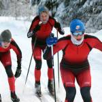 Kenai Central's Greg Fallon, Jack Laker and Tyler Hippchen battle for the lead in a 5-kilometer mass start classic race Saturday, Dec. 11, 2021, at Tsalteshi Trails just outside of Soldotna, Alaska. (Photo by Jeff Helminiak/Peninsula Clarion)