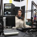 Sabine Poux anchors KDLLs evening news show on Monday, Dec. 13, 2021 in Kenai, Alaska. KDLL will add a reporter to its staff through the Report for America program. (Ashlyn OHara/Peninsula Clarion)