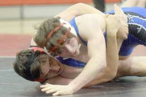 Kenai Central's Owen Whicker and Soldotna's Ezekiel Miller wrestle at Kenai Central High School on Tuesday, Nov. 16, 2021, in Kenai, Alaska. (Photo by Jeff Helminiak/Peninsula Clarion)