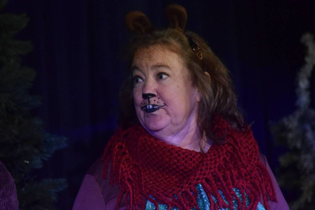 Terri Burdick acts as her character Mrs. Burdick during the Triumvirate Theatres rehearsal of The Chronicles of Narnia: The Lion, the Witch and the Wardrobe at Kenai Central High School on Tuesday, Dec. 14, 2021. (Camille Botello/Peninsula Clarion)
