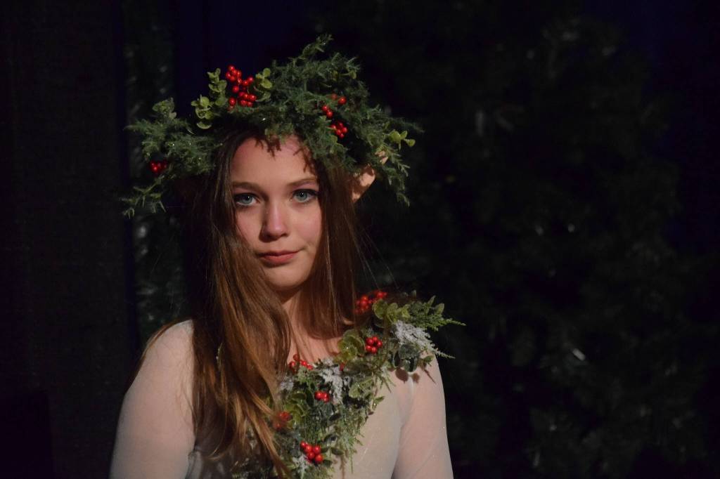 Kate Cox acts as her wood nymph character during the Triumvirate Theatres rehearsal of The Chronicles of Narnia: The Lion, the Witch and the Wardrobe at Kenai Central High School on Tuesday, Dec. 14, 2021. (Camille Botello/Peninsula Clarion)
