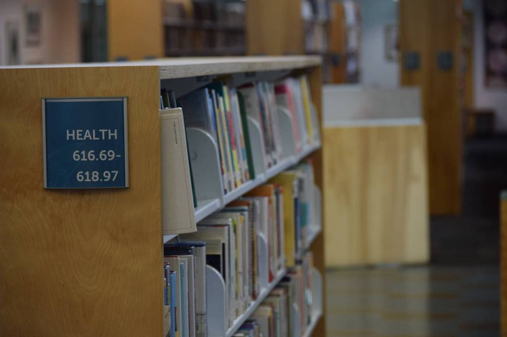 The Kenai Community Library health section is seen on Tuesday, Oct. 26, 2021. After the Kenai City Council postponed a vote to approve a grant funding health and wellness book, community members set up a GoFundMe to support the purchase of materials. (Camille Botello/Peninsula Clarion)