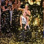 Miss Alaska Emma Broyles reacts as she is crowned by 2020 Miss America Camille Schrier, after winning the Miss America competition, Thursday, Dec. 16, 2021, at Mohegan Sun in Uncasville, Conn. (AP Photo/Jessica Hill)