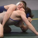 Soldotna High Schools Wayne Mellon wins a DI wrestling title during the state tournament at the Alaska Airlines Center in Anchorage on Saturday, Dec. 18, 2021. (Camille Botello/Peninsula Clarion)