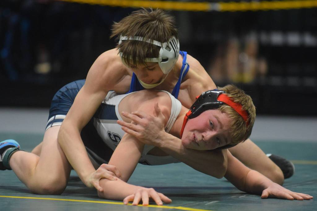 Soldotnas Jacob Strausbaugh competes in the Division I state wrestling championship at the Alaska Airlines Center in Anchorage on Saturday, Dec. 18, 2021. (Camille Botello/Peninsula Clarion)