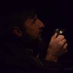 Jim Allemann watches his Christmas light show outside his house in Nikiski on Sunday, Dec. 19, 2021. (Camille Botello/Peninsula Clarion)