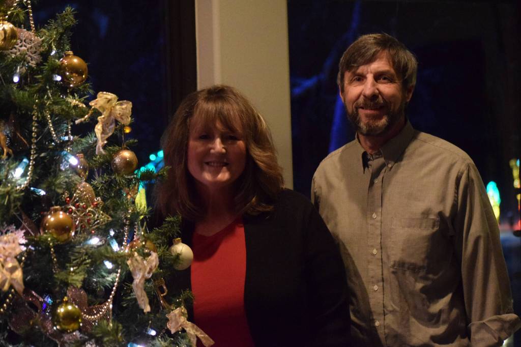 Robin and Jim Allemann, seen here in their Nikiski home on Sunday, Dec. 19, 2021, put on a Christmas light show in their front yard every year. (Camille Botello/Peninsula Clarion)