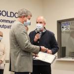 Alaska VA Healthcare System Executive Director Tom Steinbrunner (right) presents Central Peninsula Hospital CEO Rick Davis (left) with an award during a ribbon cutting ceremony on Wednesday, Dec. 29, 2021 in Soldotna, Alaksa. (Ashlyn OHara/Peninsula Clarion)