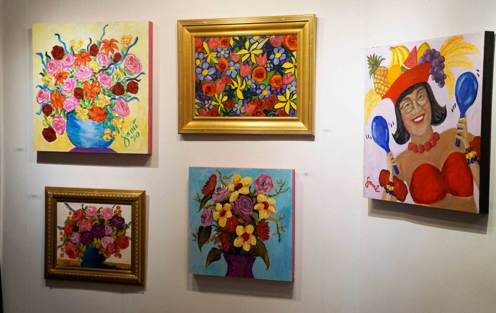 Some of the paintings in Dr. Sami Alis exhibit, The Mind of a Healthcare Worker During the COVID-19 Pandemic, showing in January 2022 at the Homer Council on the Arts in Homer, Alaska. The paintings are displayed chronologically and in the order Ali painted them. This group was from the spring of 2021 when vaccines became widely available. (Photo by Michael Armstrong/Homer News)