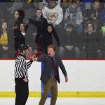 Fairbanks head coach Trevor Stewart argues a penalty call on the ice with a referee Saturday, Nov. 23, 2019, at the Soldotna Regional Sports Complex in Soldotna, Alaska. (Photo by Joey Klecka/Peninsula Clarion)