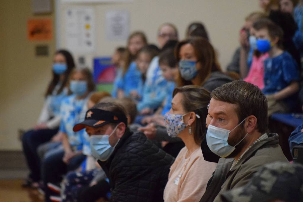 Parents, guardians, staff and students gather to celebrate the National Blue Ribbon award during an assembly at Soldotna Montessori Charter School on Friday, Jan 14, 2022. (Camille Botello / Peninsula Clarion)