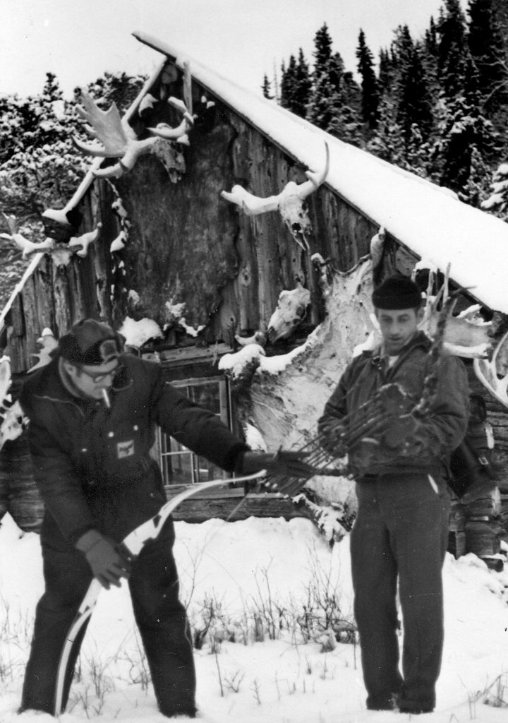Photo courtesy of the Letzring Family
David Letzring (left) and an unidentified man manipulate a bow behind Cliff House in the early 1970s.