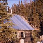 The spruce-covered cliffs behind Cliff House were the inspiration for the cabin’s name. (Photo courtesy of the Fair Family Collection)
