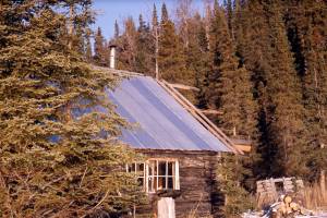 The spruce-covered cliffs behind Cliff House were the inspiration for the cabin’s name. (Photo courtesy of the Fair Family Collection)