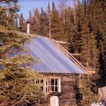 The spruce-covered cliffs behind Cliff House were the inspiration for the cabins name. (Photo courtesy of the Fair Family Collection)
