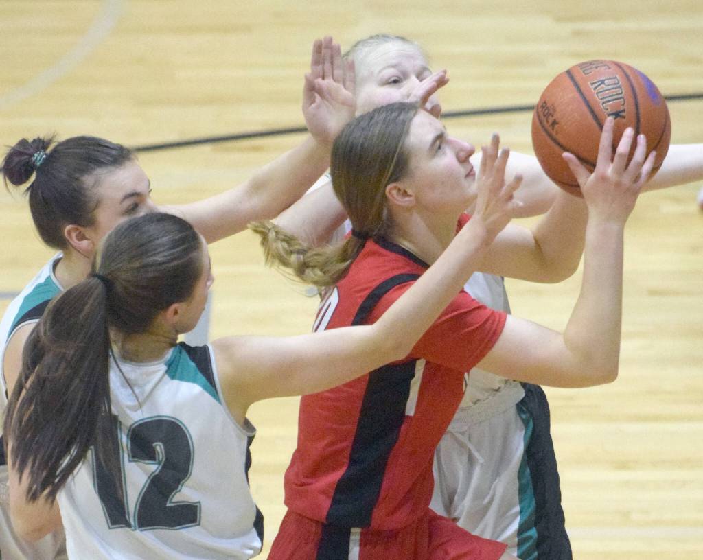 Kenai Centrals Erin Koziczkowski goes up for a shot against Nikiski on Friday, Jan. 14, 2022, at Nikiski High School in Nikiski, Alaska. (Photo by Jeff Helminiak/Peninsula Clarion)