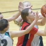 Kenai Central's Erin Koziczkowski goes up for a shot against Nikiski on Friday, Jan. 14, 2022, at Nikiski High School in Nikiski, Alaska. (Photo by Jeff Helminiak/Peninsula Clarion)