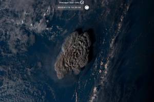 This satellite image taken by Himawari-8, a Japanese weather satellite operated by Japan Meteorological Agency and released by National Institute of Information and Communications Technology (NICT), shows an undersea volcano eruption at the Pacific nation of Tonga Saturday, Jan. 15, 2022. (NICT via AP)