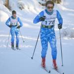 Soldotna High Schools Quinten Cox leads teammate Benn Abel up the Raven loop during an interval classic race Sunday, Jan. 16, 2022, at Besh Cup 4 at Tsalteshi Trails just outside of Soldotna, Alaska. (Photo by Jeff Helminiak/Peninsula Clarion)