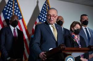 Senate Majority Leader Chuck Schumer, D-N.Y., speaks to reporters alongside, from left, Sen. Raphael Warnock, D-Ga., Sen. Cory Booker, D-N.J., Sen. Amy Klobuchar, D-Minn., and Sen. Alex Padilla, D-Calif., during a press conference regarding the Democratic partys shift to focus on voting rights at the Capitol in Washington, Tuesday, Jan. 18, 2022. (AP Photo/Amanda Andrade-Rhoades)