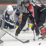 Soldotnas Zeek Miller and Houstons Daniel Matveev battle for the puck Thursday, Jan. 20, 2022, at the Soldotna Regional Sports Complex in Soldotna, Alaska. (Photo by Jeff Helminiak/Peninsula Clarion)
