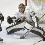 Kenai River Brown Bears goalie Tommy Aitken makes a save against the Janesville (Wisconsin) Jets on Sunday, Jan. 23, 2022, at the Soldotna Regional Sports Complex in Soldotna, Alaska. (Photo by Jeff Helminiak/Peninsula Clarion)