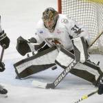 Kenai River Brown Bears goalie Tommy Aitken makes a save against the Janesville (Wisconsin) Jets on Sunday, Jan. 23, 2022, at the Soldotna Regional Sports Complex in Soldotna, Alaska. (Photo by Jeff Helminiak/Peninsula Clarion)