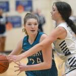 Nikiskis Ashlynne Playle keeps the ball from Soldotnas Adarra Hagelund on Tuesday, Feb. 8, 2022, at Soldotna High School in Soldotna, Alaska. (Photo by Camille Botello/Peninsula Clarion)