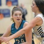 Nikiski's Ashlynne Playle keeps the ball from Soldotna's Adarra Hagelund on Tuesday, Feb. 8, 2022, at Soldotna High School in Soldotna, Alaska. (Photo by Camille Botello/Peninsula Clarion)