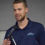 Josiah Martin accepts the Soldotna Chamber of Commerces commitment to customer service award for his work at Martin Media during the chambers 2021 award ceremony at the Soldotna Regional Sports Complex on Wednesday, Feb. 9, 2022. (Camille Botello/Peninsula Clarion)