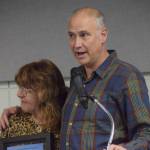 Mary Krull, with husband Henry Krull, accept the Soldotna Chamber of Commerces business of the year award for their work at Brew 602 and Addie Camp during the chambers 2021 award ceremony at the Soldotna Regional Sports Complex on Wednesday, Feb. 9, 2022. (Camille Botello/Peninsula Clarion)