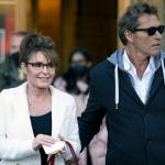 Sarah Palin is escorted to her car by Ron Duguay after leaving the courthouse in New York, Thursday, Feb. 10, 2022. Former Alaska Gov. Sarah Palin told a jury Thursday she felt like she was at the mercy of a “Goliath” when she first learned a 2017 New York Times editorial suggested her campaign rhetoric helped incite a mass shooting.(AP Photo/Seth Wenig)