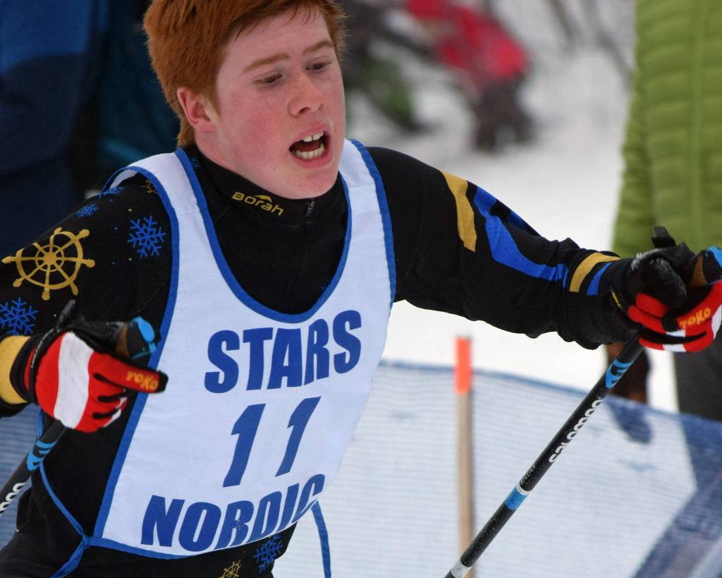 Homers Jody Goodrich finishes the boys 7.5-kilometer classic mass start Saturday, Feb. 12, 2022, at the Region III ski championshps at Tsalteshi Trails just outside of Soldotna, Alaska. (Photo by Camille Botello/Peninsula Clarion)