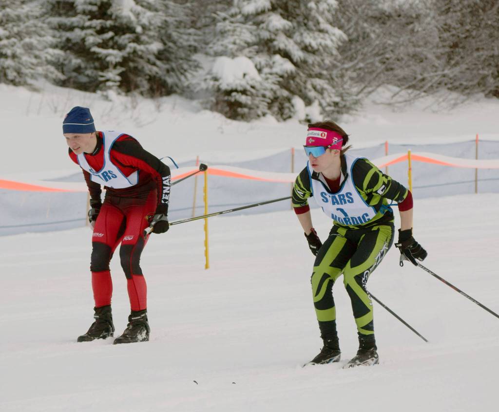 Kenai Centrals Jack Laker and Colonys Jayden Rice race in the 7.5-kilometer classic mass start at the Region III ski championships Saturday, Feb. 12, 2022, at Tsalteshi Trails just outside of Soldotna, Alaska. (Photo by Camille Botello/Peninsula Clarion)