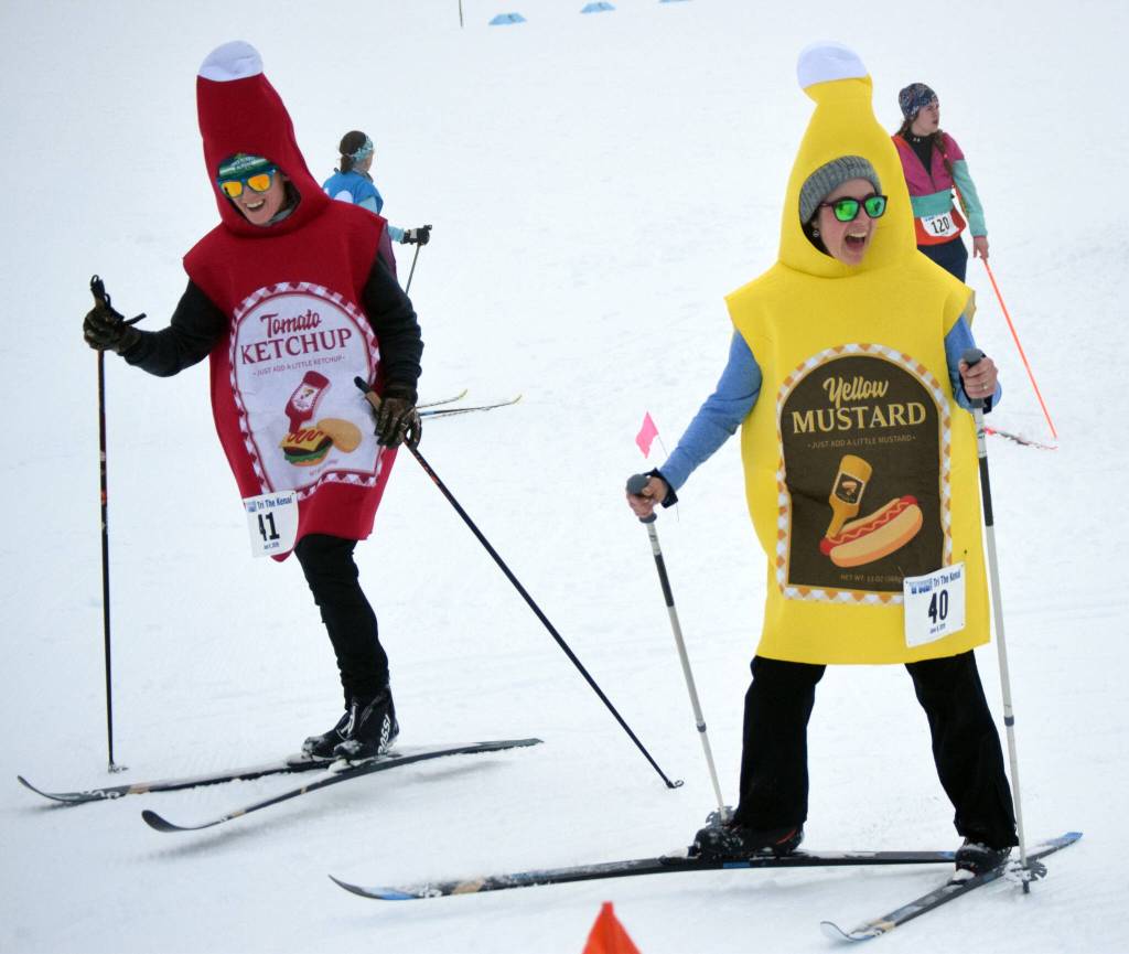 Chelsea Wingard and Cherie Taylor ski at the Ski for Women on Sunday, Feb. 13, 2022, at Tsalteshi Trails just outside of Soldotna, Alaska. (Photo by Jeff Helminiak/Peninsula Clarion)