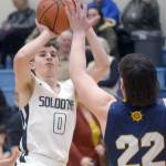 Soldotnas Zac Buckbee rises for a shot against Homers Carter Tennison on Thursday, Feb. 17, 2022, at Soldotna High School in Soldotna, Alaska. (Photo by Camille Botello/Peninsula Clarion)