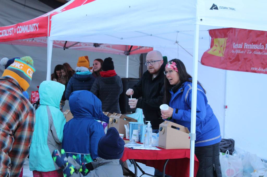 Hot chocolate is dispensed at a Kenai Peninsula Foundation booth during Frozen RiverFest on Saturday, Feb. 19, 2022 in Soldotna, Alaska. (Ashlyn OHara/Peninsula Clarion)
