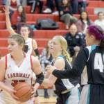 Kenai Centrals Denali Bernard keeps the ball from Nikiskis Avery White and Destiny Langston on Tuesday, Feb. 22, 2022, at Kenai Central High School in Kenai, Alaska. (Photo by Camille Botello/Peninsula Clarion)
