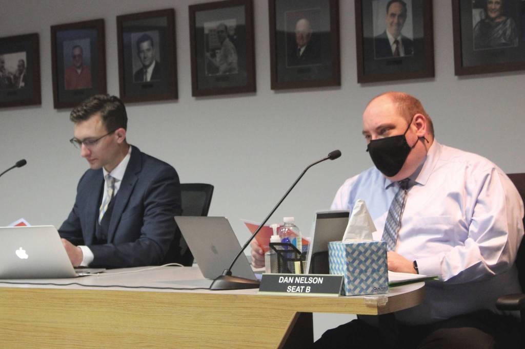 Soldotna City Council members Dan Nelson (right) and Jordan Chilson (left) attend a meeting of the Soldotna City Council on Wednesday, Feb. 23, 2022 in Soldotna, Alaska. (Ashlyn OHara/Peninsula Clarion)