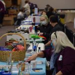Community agencies administer social services to those in need during the Project Homeless Connect event in Soldotna on Wednesday, Jan. 26, 2022. (Camille Botello/Peninsula Clarion)