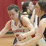 Kenai Central's Logan Satathite dribbles against Soldotna's Josie Sheridan on Friday, Feb. 25, 2022, at Kenai Central High School in Kenai, Alaska. (Photo by Jeff Helminiak/Peninsula Clarion)