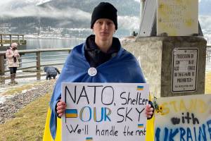 Michael S. Lockett / Juneau Empire
Viktor Tkachenko, who moved to Alaska from Ukraine last year, holds a sign asking NATO for assistance defeating Russian airpower at a protest against the war Saturday in Marine Park.