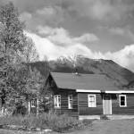 Photo from the Moose Pass Public Library online archive
The main building at Wolf Trail Lodge, near Moose Pass, had a brief history in the 1950s. Part of that history included the last stand of fugitives Chester L. Oughton and Frank C. Oliver.
